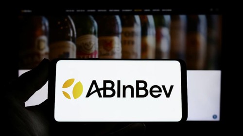 Stuttgart, Germany, 04-04-2023: Person holding smartphone with logo of brewing company