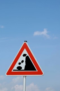 Warning sign Caution: falling rocks