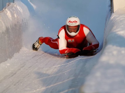 Man riding a skeleton sled at the Innsbruck bobsleigh track, Igls Olympic Bobsled Run, Igls,