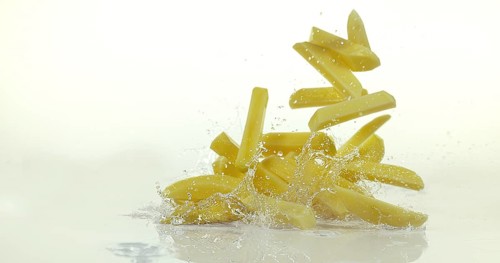 French Fries, Charlotte Potato (solanum tuberosum), Vegetable falling on Water against White