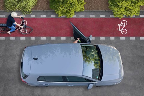Cyclist on a collision course with an open car door
