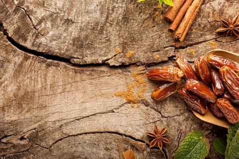 Top view dates cinnamon sticks