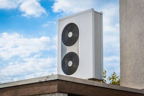 A heat pump on the roof of a garage in Langenfeld, Germany, Europe