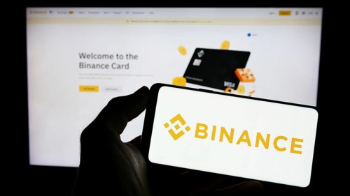 Stuttgart, Germany, 03-31-2023: Person holding mobile phone with logo of crypto exchange company