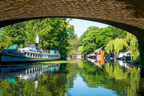 Berlin, Germany, June 2022: View on houseboat on the Spree river in Berlin in Tiergarten, Europe
