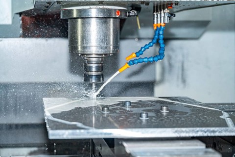 Close-up of a cnc modern milling machine cutting a mould