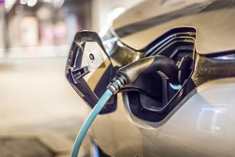 Electric car recharging with charge cable and plug leading to charge point