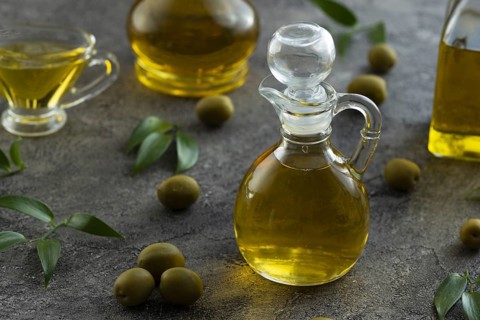 High view of bottles filled with olive oil on marble background Picture on pik. Resolution and high