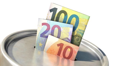 Donation box with euro banknotes. Isolated donation box with Euro banknotes