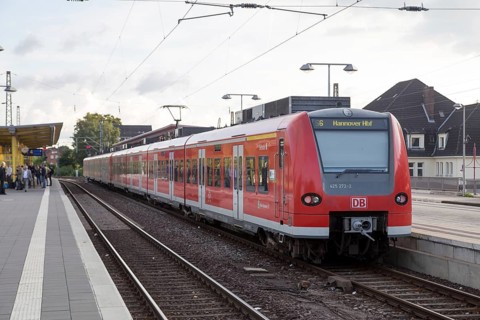 Celle, Germany, August 08, 2016: Regional train parked at the railway station and people waiting,