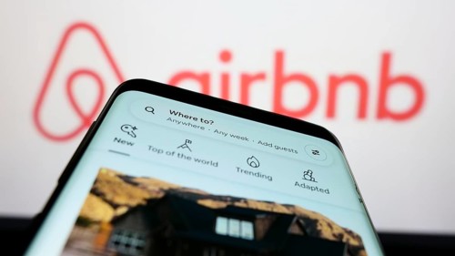 Stuttgart, Germany, 11-30-2022: Mobile phone with webpage of US homestay marketplace company Airbnb