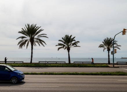 View of the sea and car on the seafront road Ma-19, Avenida de Gabrial Roca, Autopista de Llevant,