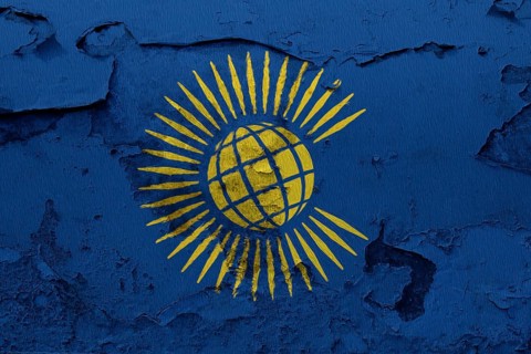 Commonwealth of Nations Flag painted on the cracked grunge concrete wall