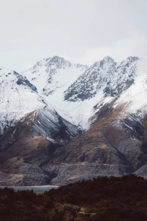 Snowy mountain landscape with clearly visible peaks under a cloudy sky, Hooker Valley Track, New