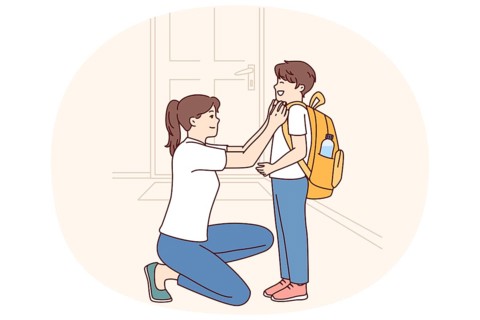 Single mother prepares young son of student in elementary school as trip to lessons and helps to
