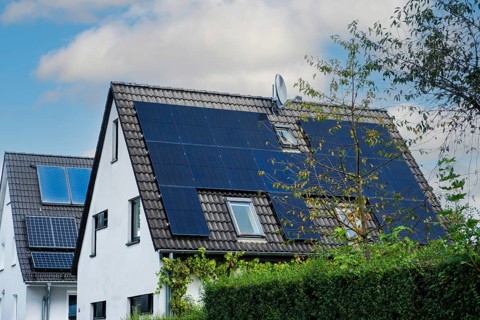 Solar panels and solar thermal energy on the roof of a detached house in Essen, Germany, Europe