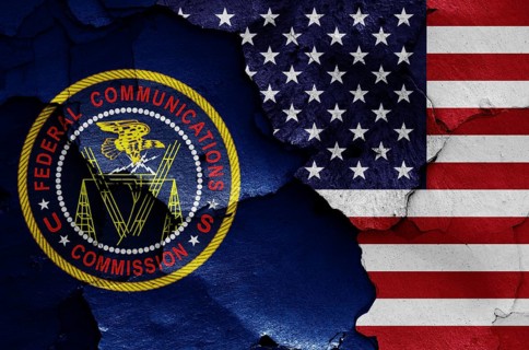 Flags of Federal Communications Commission and USA painted on cracked wall