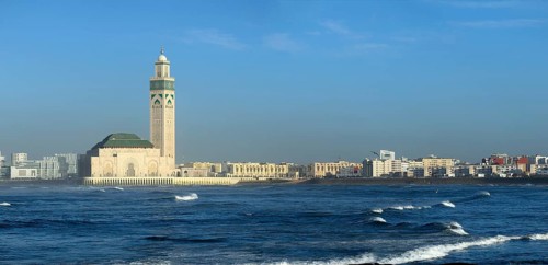 Hassan II mosque in Casablanca and Atlantic ocean waves at sunset, Morocco, panorama, Africa
