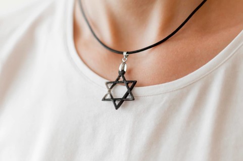 Front view person wearing david s star pendant