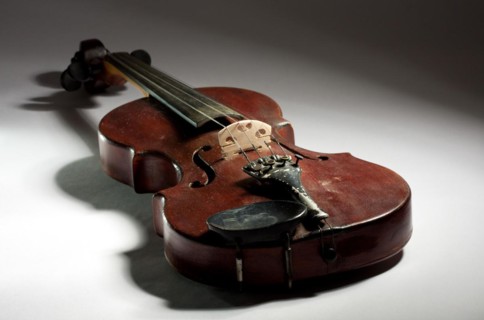Extremely old master violin on light background