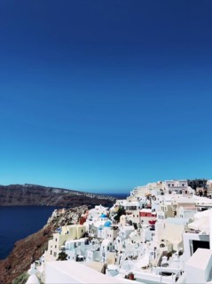 Amazing panorama view of beautiful Oia town on Santorini volcanic island, Greece, Aegean Sea.