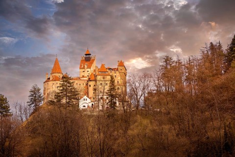 Beautiful panoramic view of Dracula Bran medieval castle in the sunset light, Transylvania,