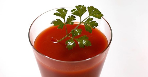 Parsley (Petroselinum crispum), falling into tomatoe's Juice