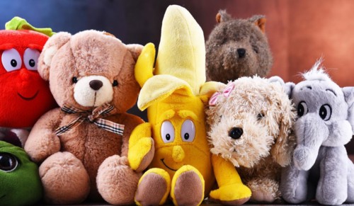 Group of stuffed animal toys in a children's room