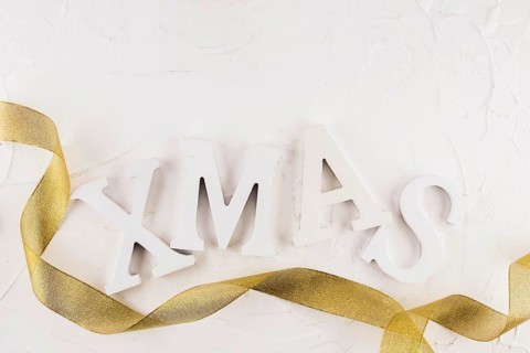 Xmas inscription with gold ribbon