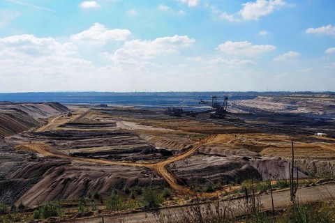 View over the Garzweiler open-cast lignite mine with large excavator, Rhenish lignite mining area,