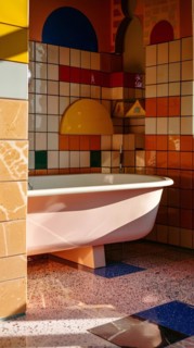 Playful and colorful bathroom design with modern tiles and a ceramic bathtub, architecture,
