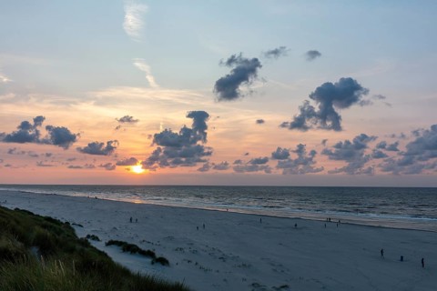 Sunset on a sandy beach with dunes, Buren, Ameland Island, Friesland, Netherlands