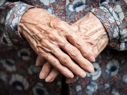 Aging process, very old senior woman hands wrinkled skin