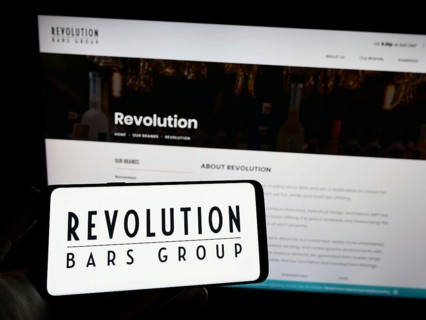 Stuttgart, Germany, 01-25-2023: Person holding smartphone with logo of hospitality company