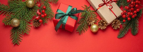 Christmas or New Year celebration red paper festive background with decoration fir tree, wrapped