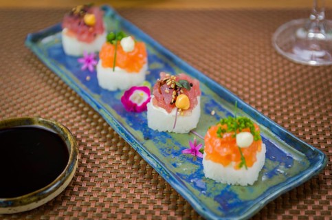 Delicious premium salmon and tuna Oshizushi sushi (Batera sushi) on a decorated handmade porcelain