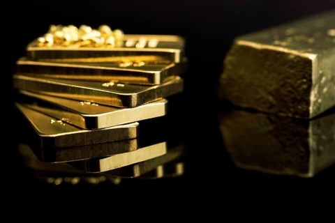 Gold bars 999 precious metal, black background