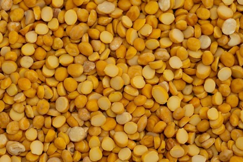 A close-up view of yellow dried split peas, creating a natural and organic texture, Close up of