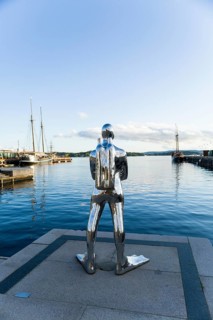 Silver diver sculpture in Oslo harbour, Norway, Europe