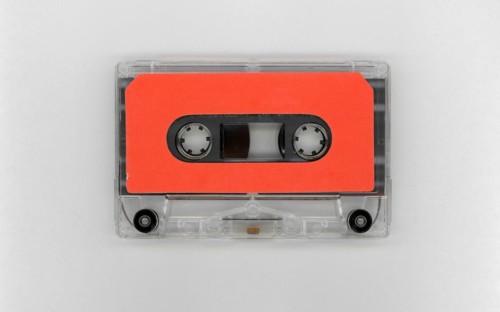 Magnetic tape cassette with blank orange label