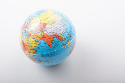 Little model globe on white background in view