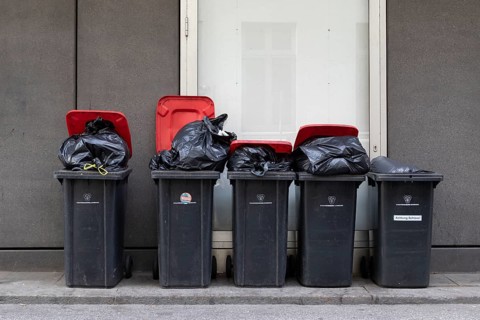 Symbolic image, symmetry, city cleaning, waste disposal, recycling, bins for residual waste filled