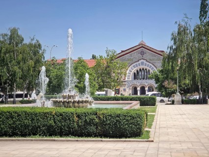 Chisinau railway station with a view from the square with splashing fountain, Republic of Moldova