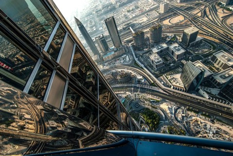 View from the great height of the Burj Khalifa of the modern architecture and skyline of Dubai with
