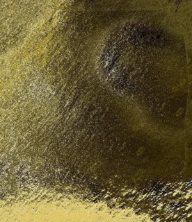 An abstract image with rough textures and a gradient transitioning from dark black to yellow,