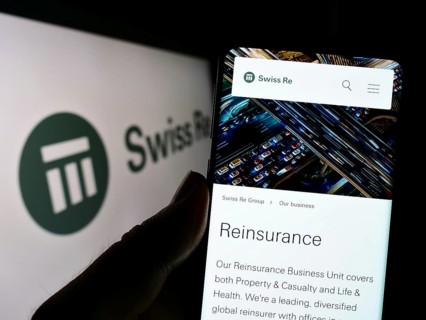 Stuttgart, Germany, 10-24-2022: Person holding cellphone with webpage of reinsurance company Swiss