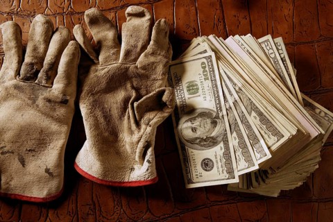 Cleaning black money dollar metaphor, dirty gloves
