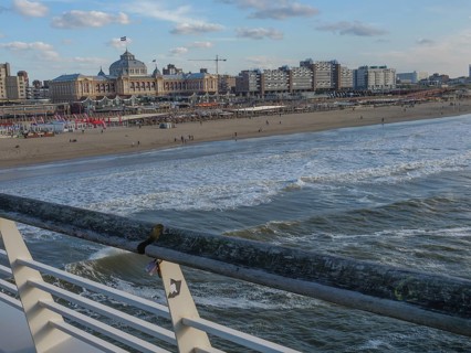 City on the beach with a view of the sea, pier and people along the coast, scheveningen, the