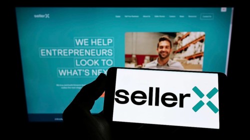 Stuttgart, Germany, 05-08-2022: Person holding cellphone with logo of e-commerce company SellerX