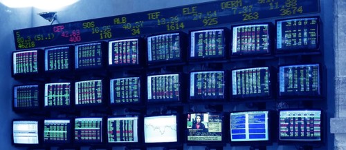 Stock market multiple screen with euro reports in Spain